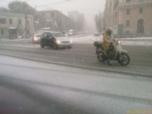 A moped caught in the snow in Rome, Italy