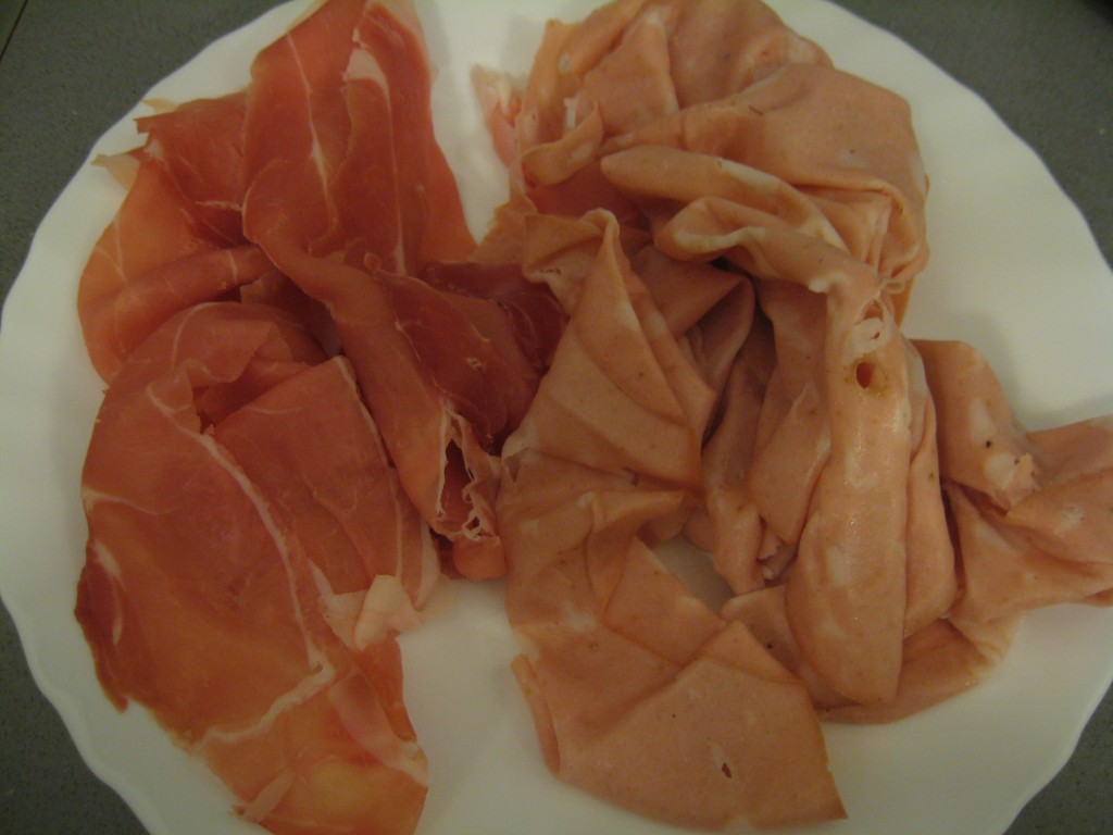 How to make tortellini: Chop mortadella and prosciutto