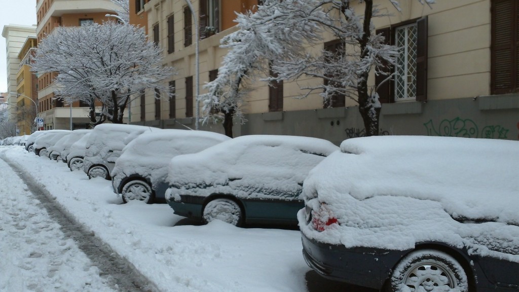 Snow in Rome 2012: Cars covered in snow