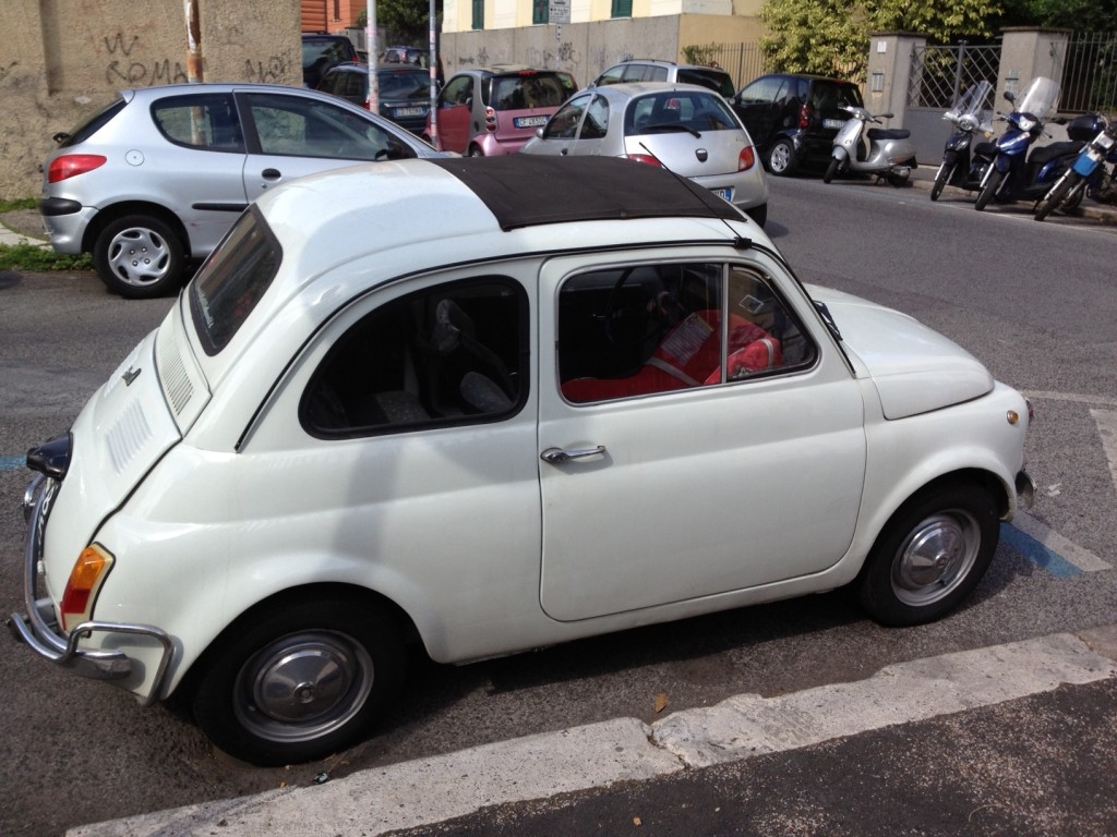 White Vintage Fiat 500: Car Seat Inside